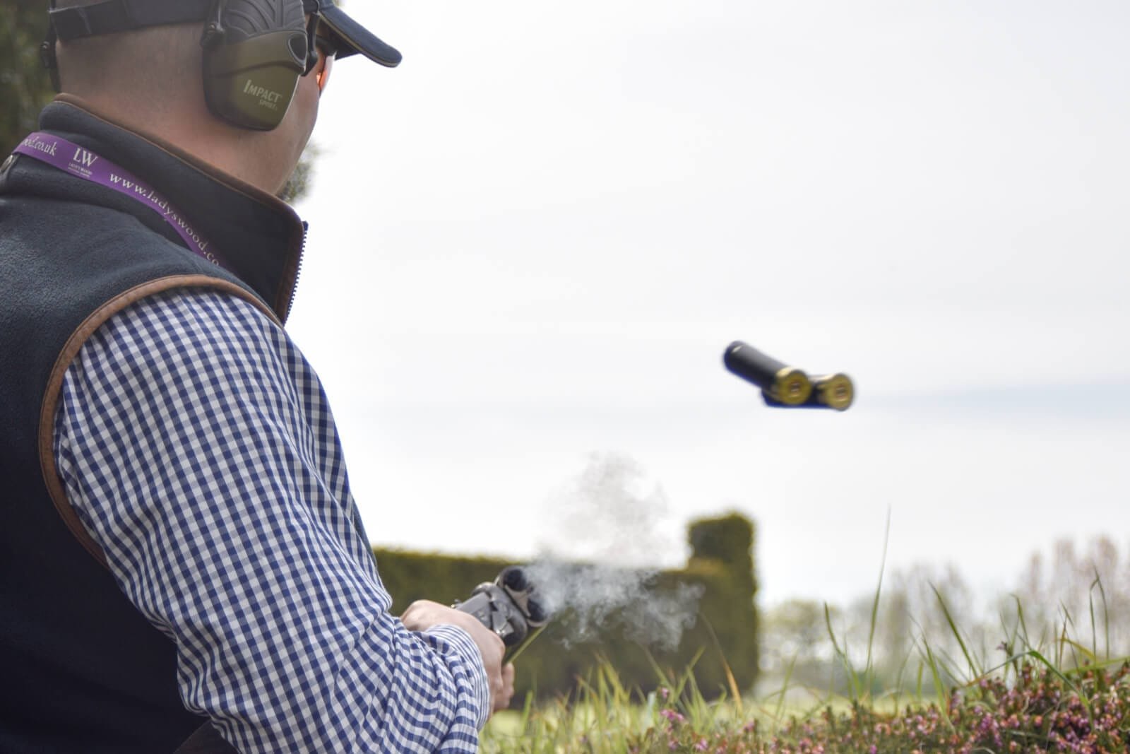 Cartridges ejecting while clay pigeon shooting at Lady's Wood Shooting School