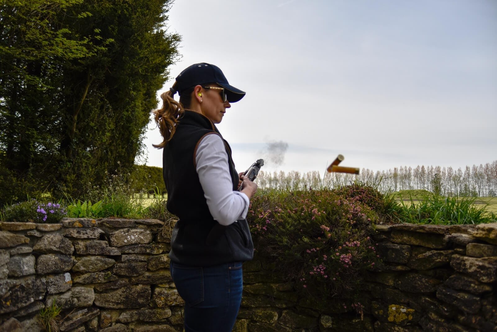 League of Lady Shooters - Cartridges ejecting while clay pigeon shooting at Lady's Wood Shooting School
