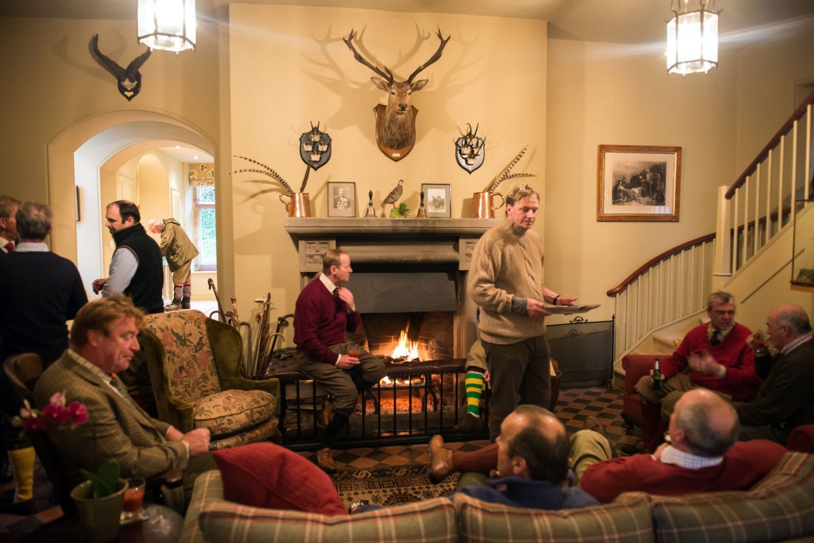 Guests gathering after a game shoot at Perrystone Estate as part of Lady's Wood Shooting School sporting agency