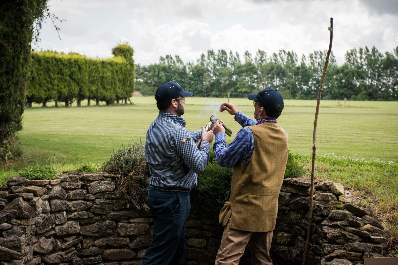 Reloading while practicing clay pigeon shooting at Lady's Wood Shooting School