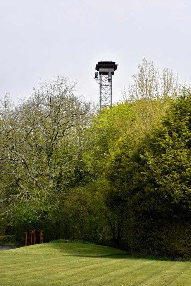 The tower and grounds of Lady's Wood Shooting School