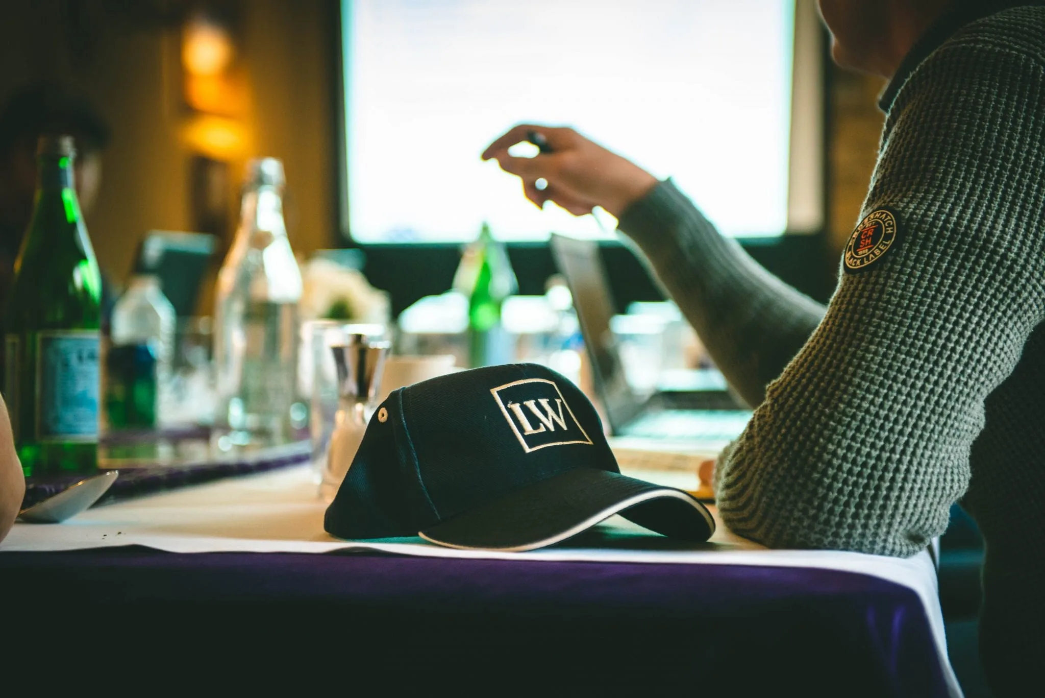 Close up of a Lady's Wood hat in the stone lodge meeting room