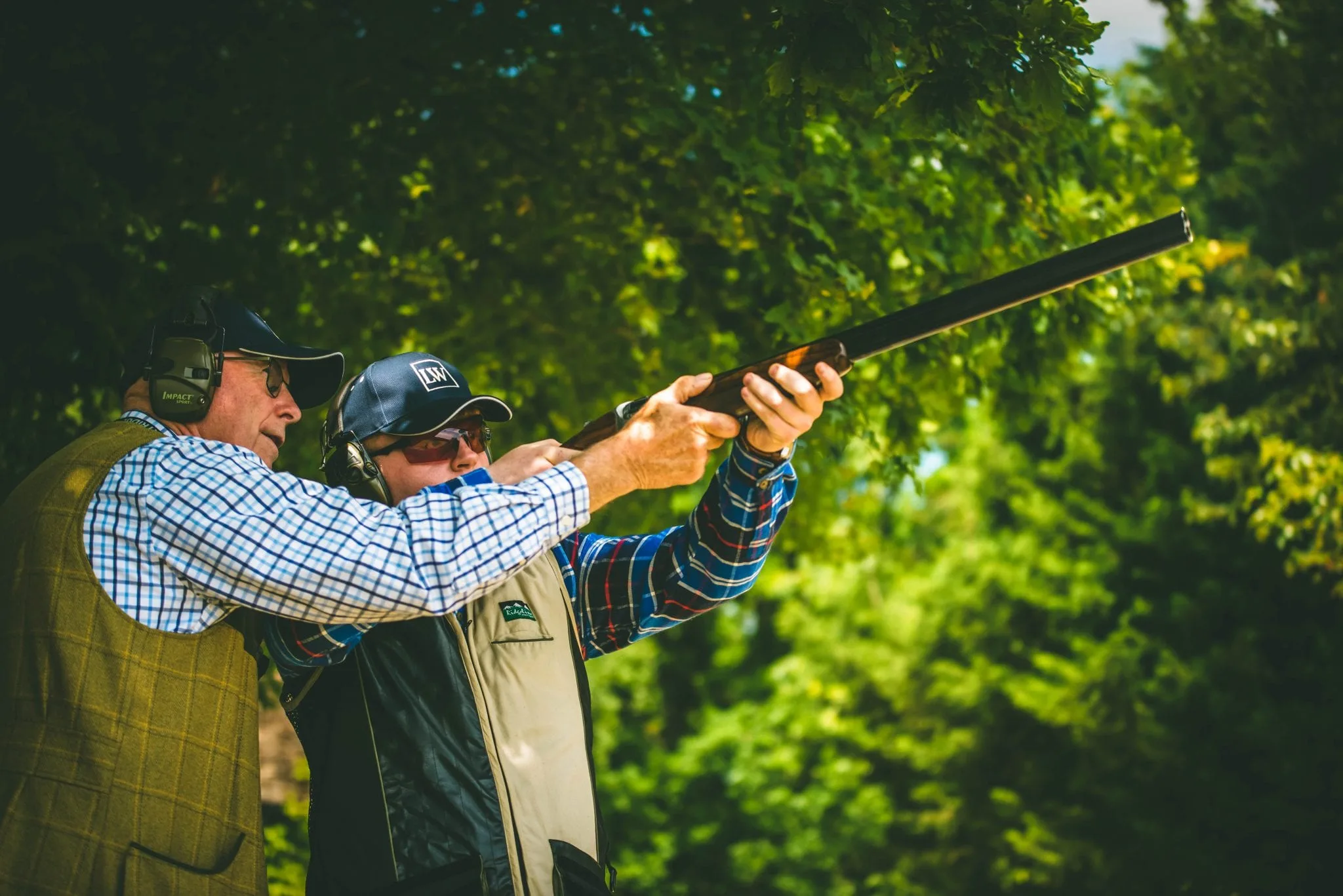 Lady's Wood owner and instructor Ernie Hemmings instructs a customer during a clay shooting lesson and helps him learn to shoot