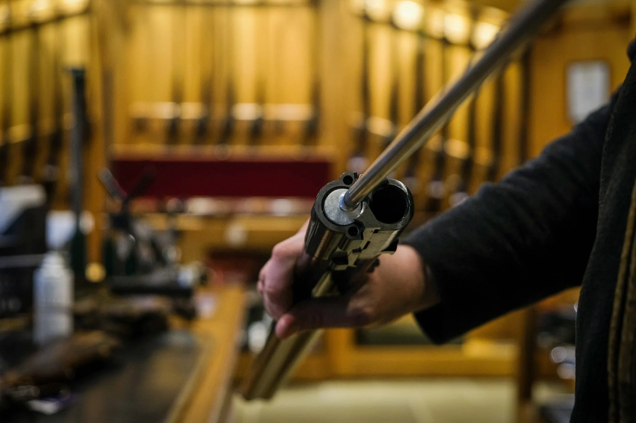 A member of the team showing how to clean a shotgun at Sportarm at Lady's Wood 